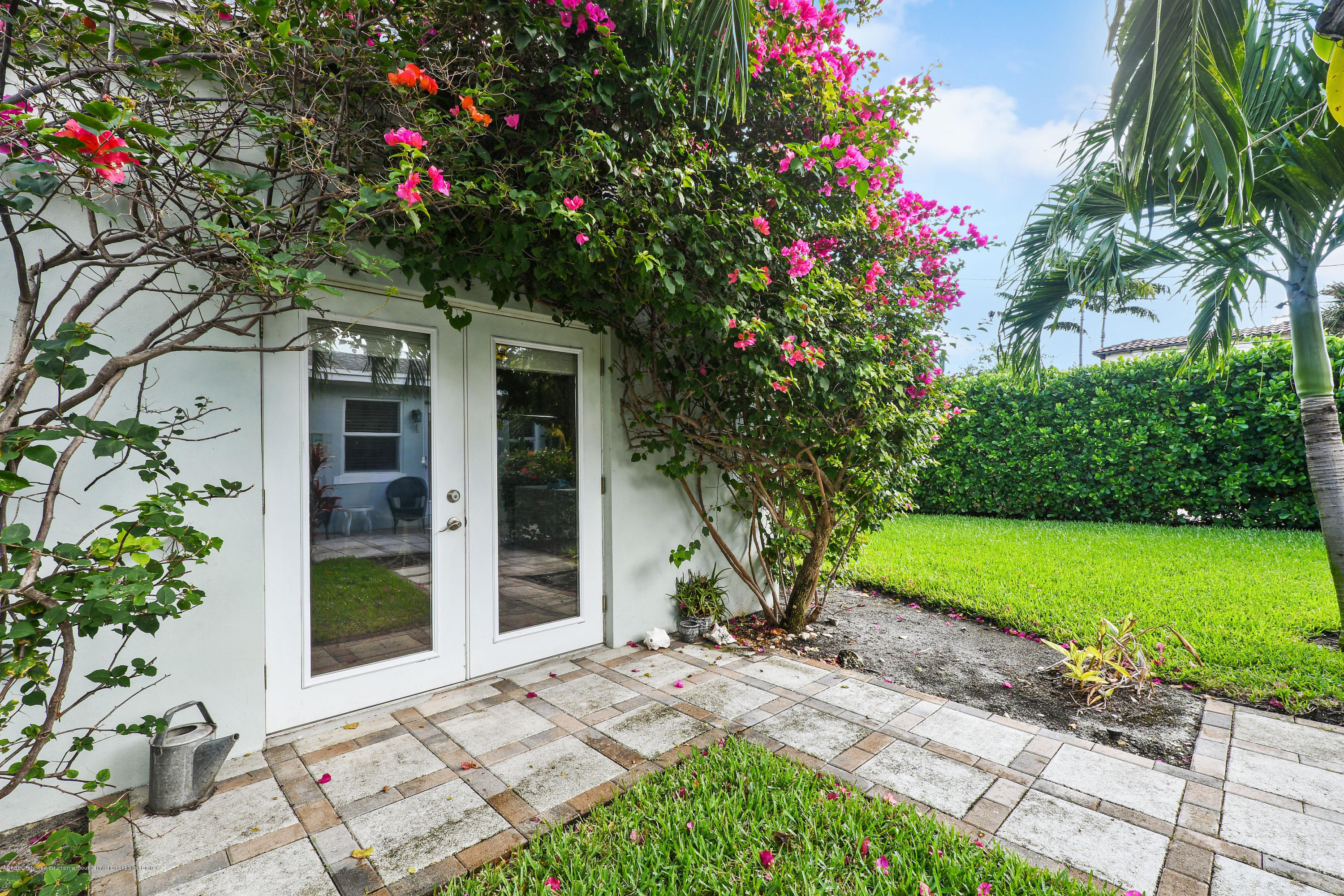 341 Murray Road West Palm Beach, FL 33405 - Photo 22 of 25 a front view of a house with a yard and fountain