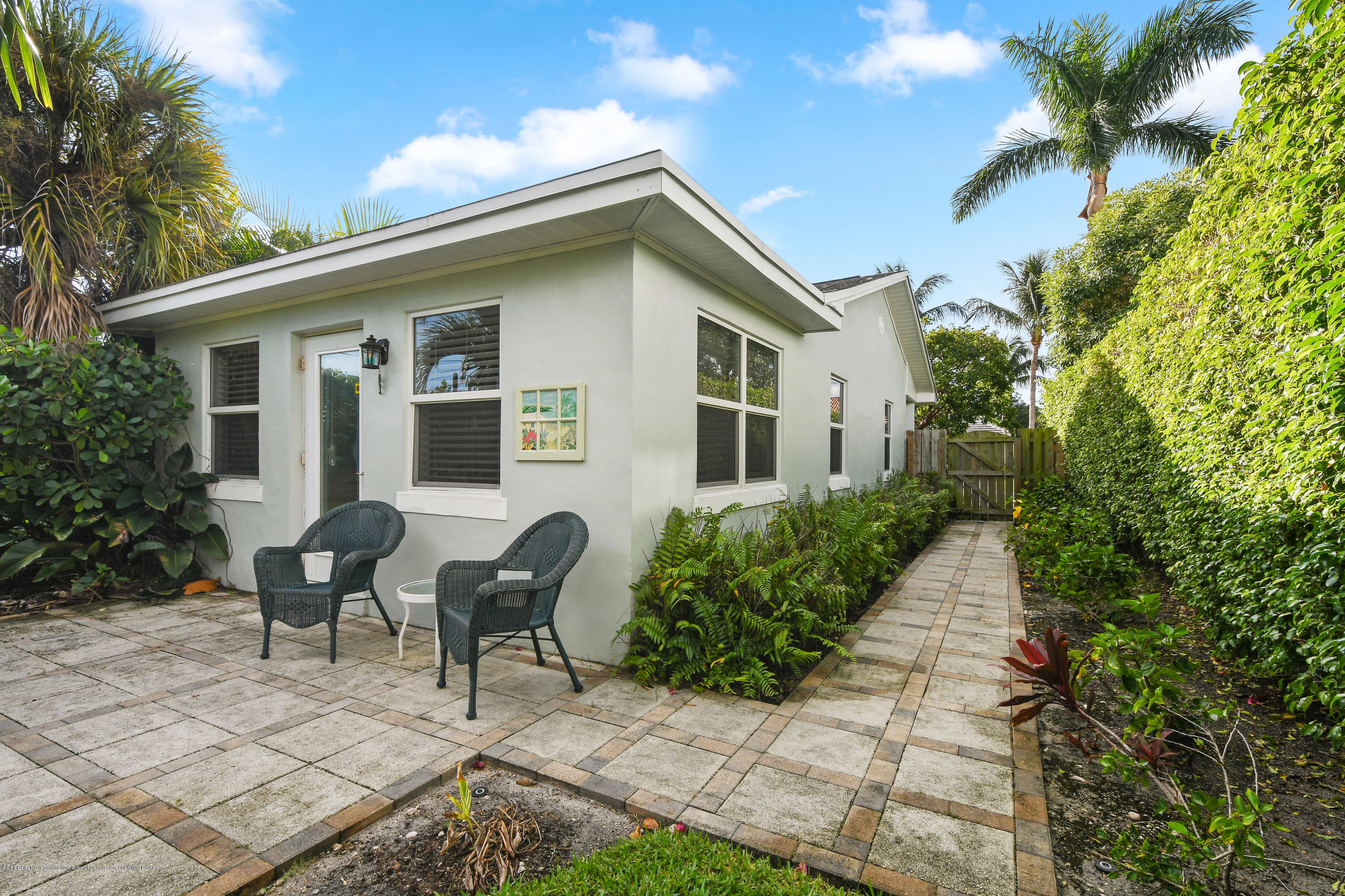 341 Murray Road West Palm Beach, FL 33405 - Photo 24 of 25 a backyard of a house with outdoor seating