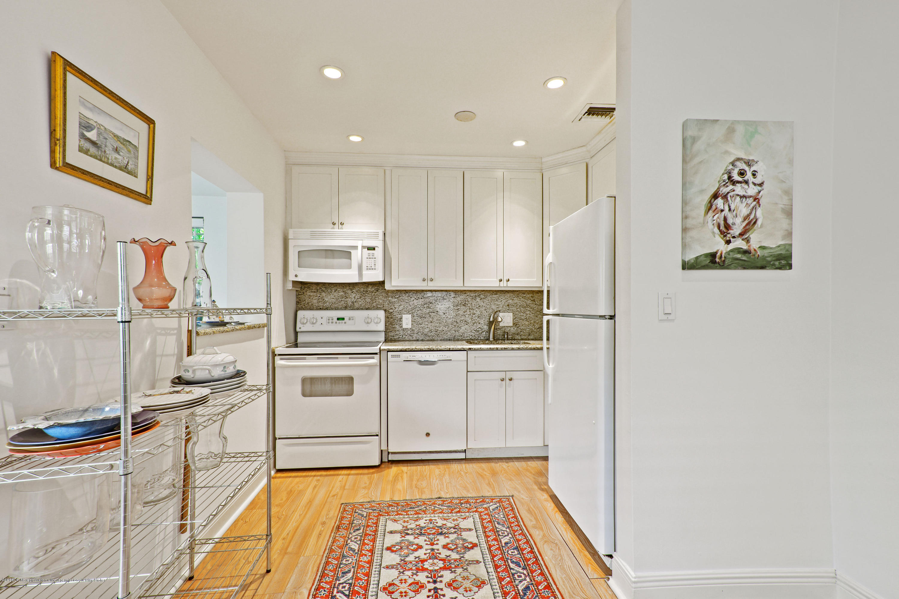 341 Murray Road West Palm Beach, FL 33405 - Photo 9 of 25 a kitchen with stainless steel appliances granite countertop a refrigerator and a stove top oven