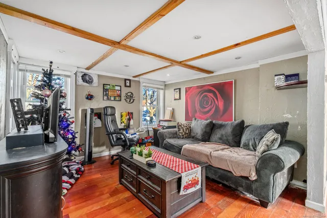 a living room with furniture a wall and a large window