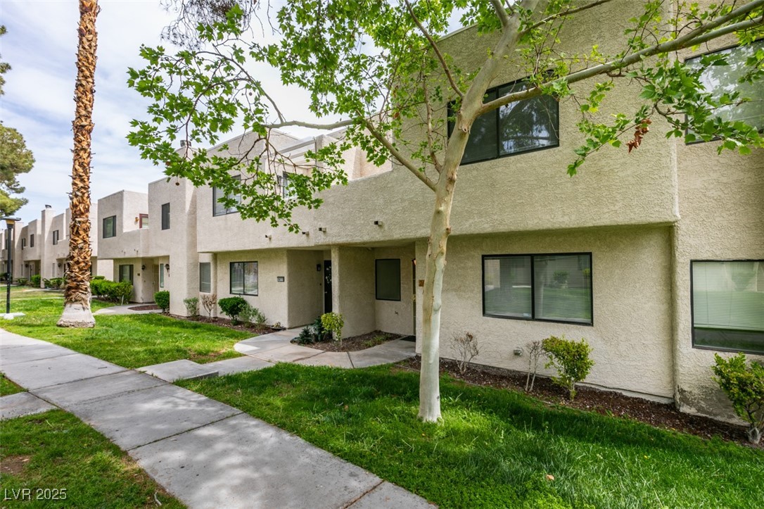 2681 Ruthe Duarte Avenue Las Vegas, NV 89121 - Photo 3 of 43 Townhome / multi-family property featuring a front yard and stucco siding