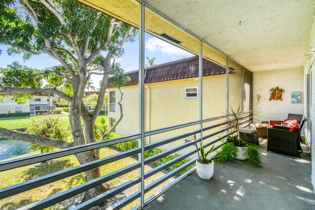 a spacious bedroom with a bed and a chandelier