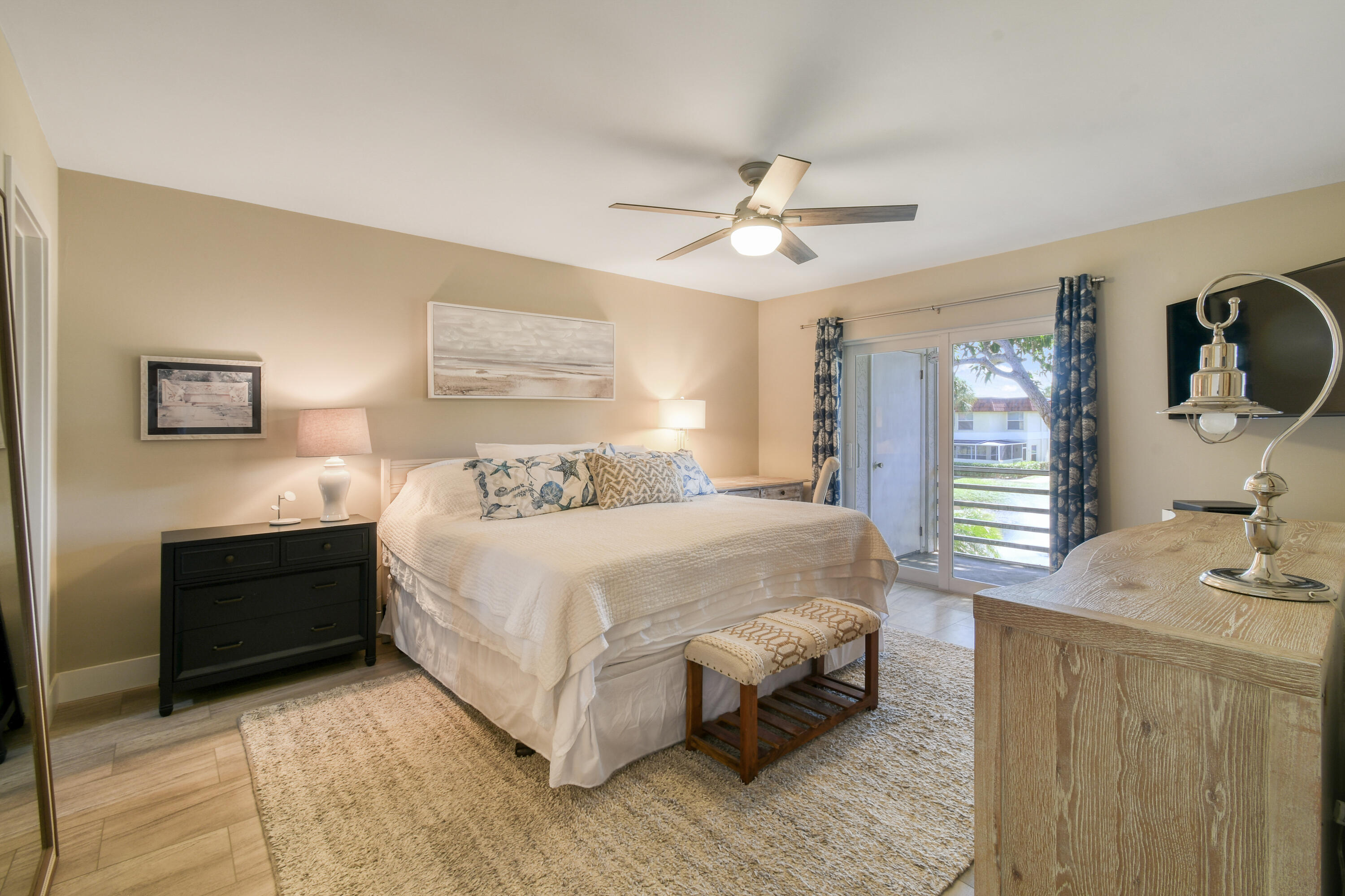 717 Highway 1, Unit 508 Jupiter, FL 33477 - Photo 19 of 66 a bedroom with a large bed and a chandelier