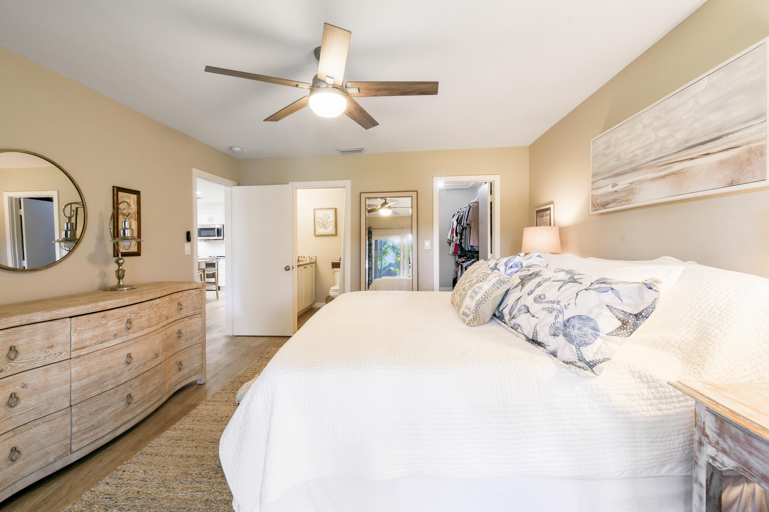 717 Highway 1, Unit 508 Jupiter, FL 33477 - Photo 23 of 66 a bedroom with a large bed and a chandelier