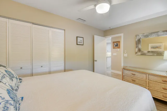 a view of a swimming pool with outdoor seating