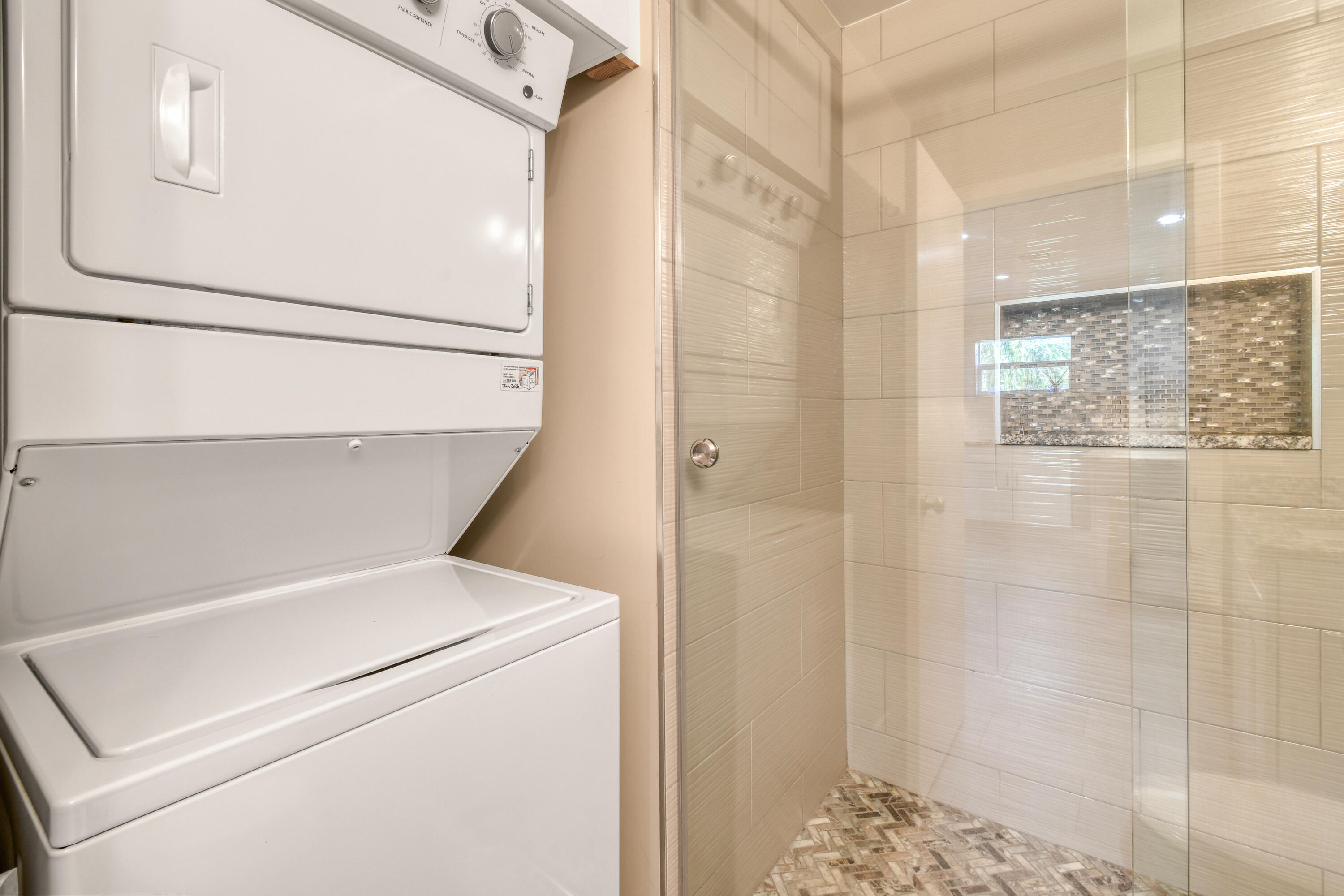 717 Highway 1, Unit 508 Jupiter, FL 33477 - Photo 32 of 66 a utility room with dryer and washer