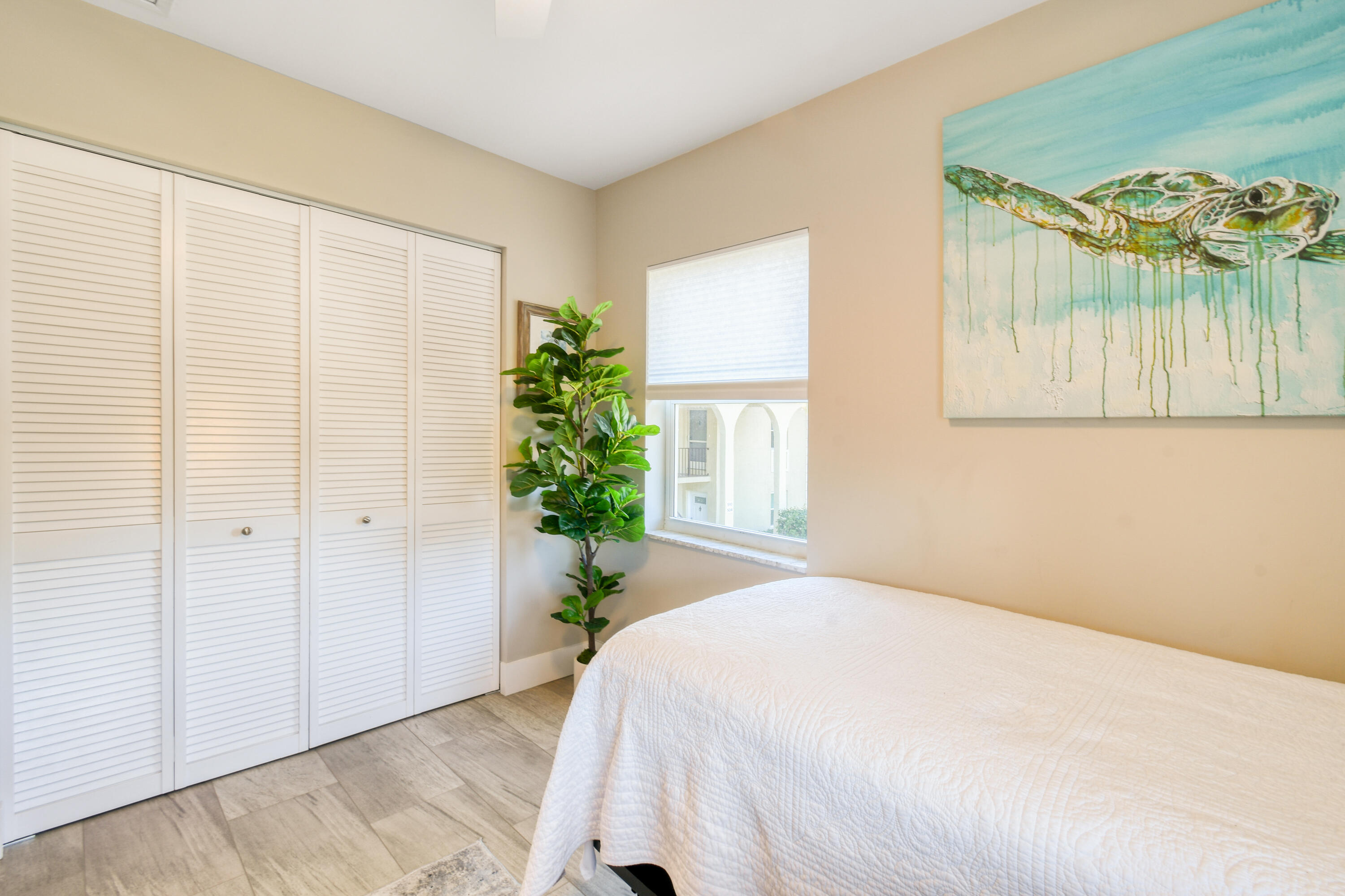 717 Highway 1, Unit 508 Jupiter, FL 33477 - Photo 35 of 66 a spacious bedroom with a bed and a window