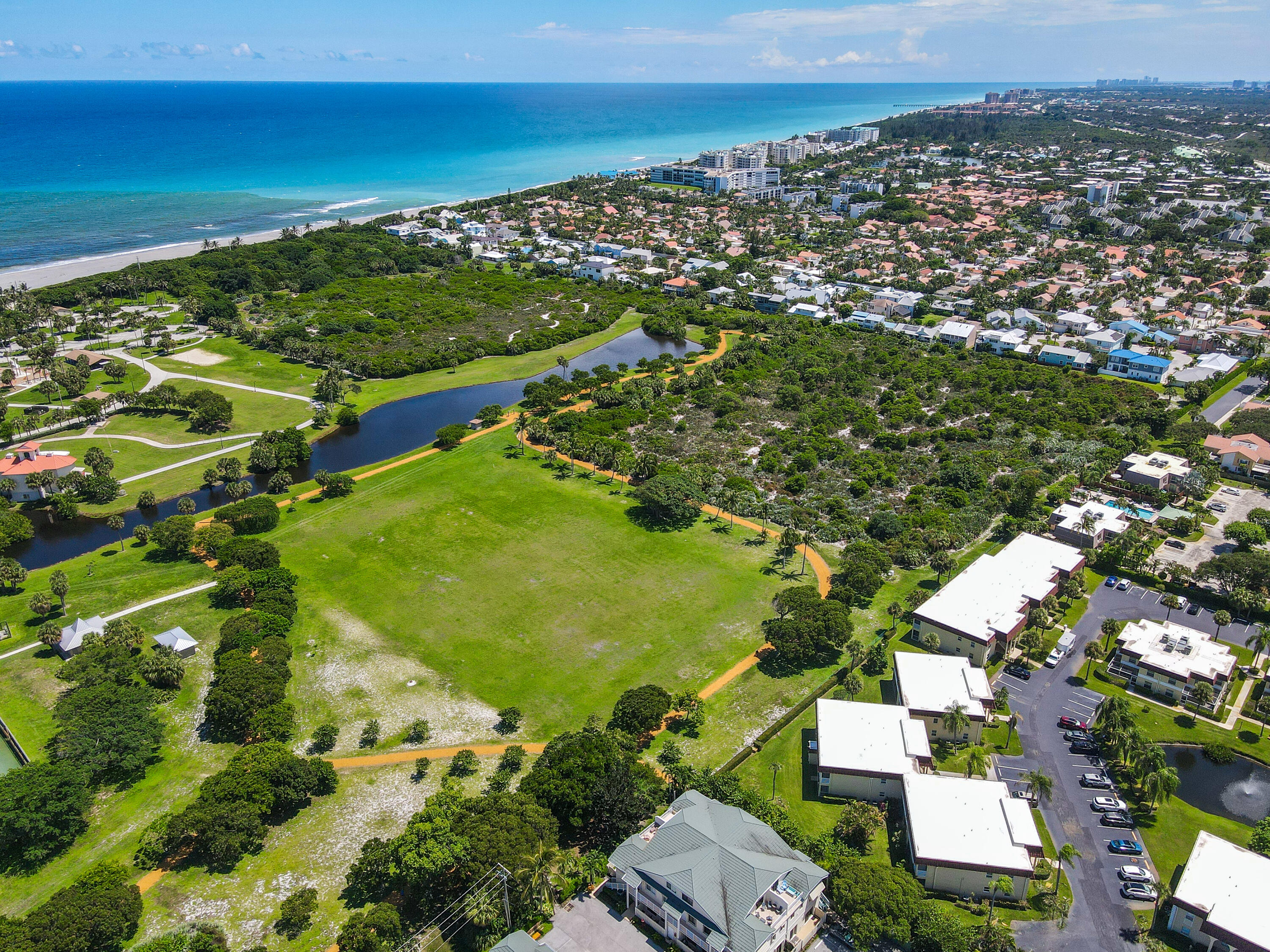 717 Highway 1, Unit 508 Jupiter, FL 33477 - Photo 48 of 66 an aerial view of residential houses with outdoor space and trees