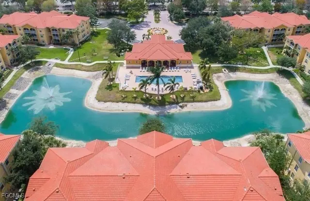 a view of a swimming pool with a yard
