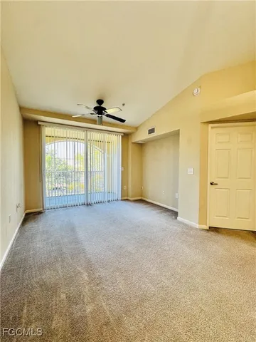 a view of an empty room with a window