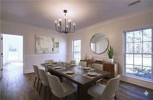 a view of a dining room with furniture window and wooden floor