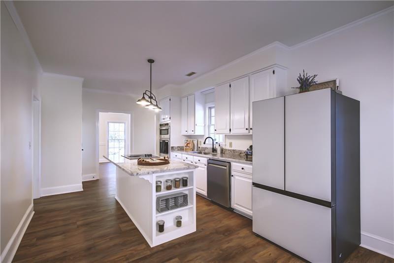 142 Carr Road LaGrange, GA 30241 - Photo 19 of 109 a kitchen with white cabinets and stainless steel appliances