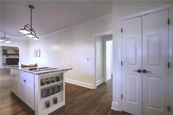 a bathroom with a granite countertop sink mirror and a bathtub