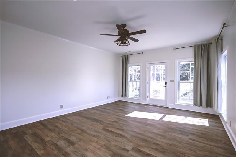142 Carr Road LaGrange, GA 30241 - Photo 32 of 109 an empty room with wooden floor and windows