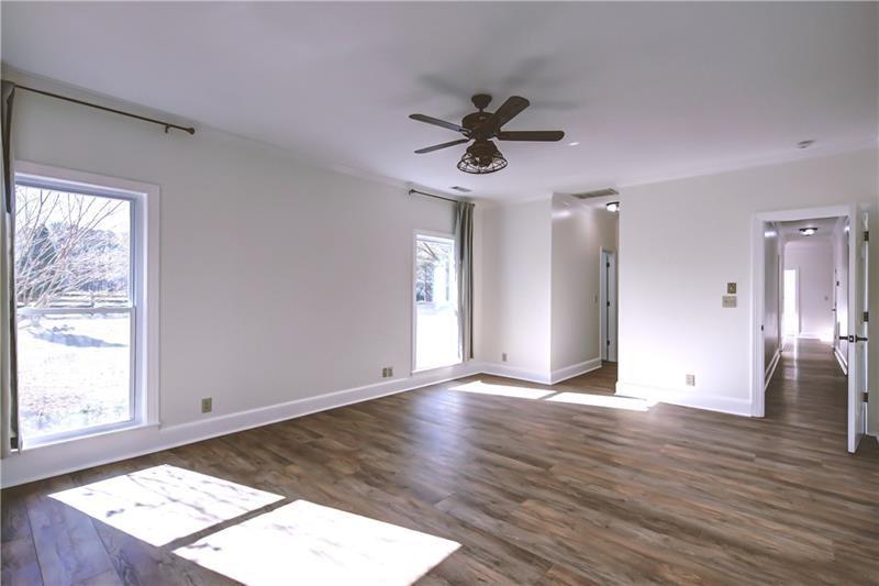142 Carr Road LaGrange, GA 30241 - Photo 33 of 109 a view of an empty room with wooden floor and a window