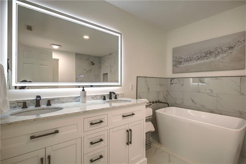 142 Carr Road LaGrange, GA 30241 - Photo 34 of 109 a bathroom with a granite countertop sink mirror and a bathtub