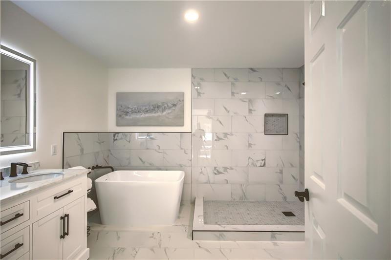 142 Carr Road LaGrange, GA 30241 - Photo 37 of 109 a bathroom with a bathtub shower sink mirror and toilet