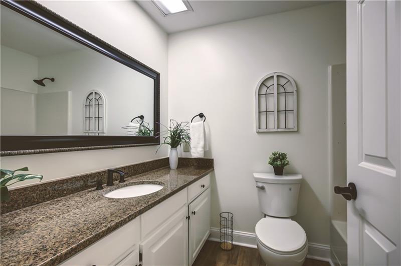 142 Carr Road LaGrange, GA 30241 - Photo 43 of 109 a bathroom with a granite countertop toilet sink and mirror