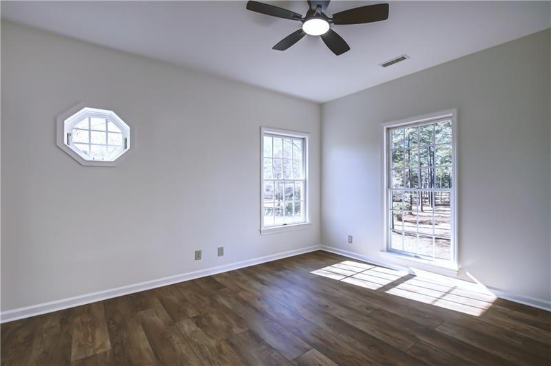 142 Carr Road LaGrange, GA 30241 - Photo 45 of 109 a view of an empty room with wooden floor and window