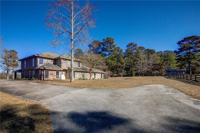 142 Carr Road LaGrange, GA 30241 - Photo 74 of 109 a front view of a house with a yard and garage