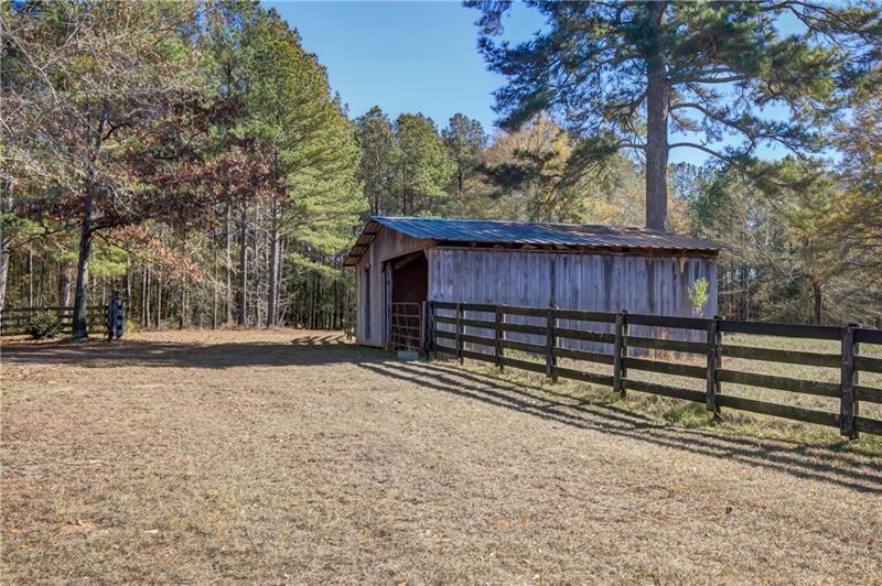 142 Carr Road LaGrange, GA 30241 - Photo 88 of 109 a view of a backyard with a large tree and wooden fence