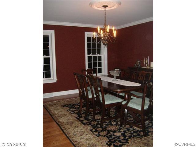 1752 Chinquapin Road Prospect, VA 23960 - Photo 12 of 16 a view of a dining room with furniture and chandelier