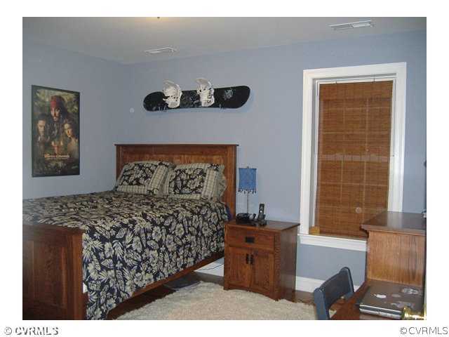 1752 Chinquapin Road Prospect, VA 23960 - Photo 13 of 16 a bed room with a bed and a window