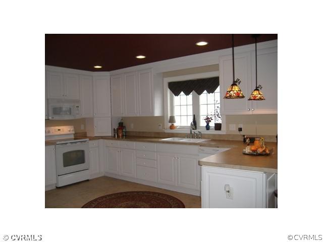 1752 Chinquapin Road Prospect, VA 23960 - Photo 4 of 16 a kitchen with a sink and cabinets