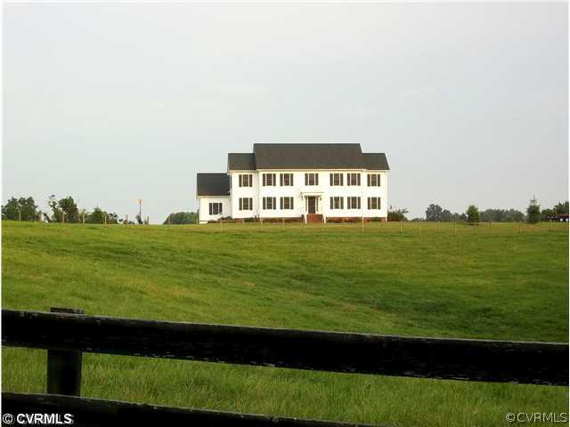 1752 Chinquapin Road Prospect, VA 23960 - Photo 6 of 16 a front view of a building with yard