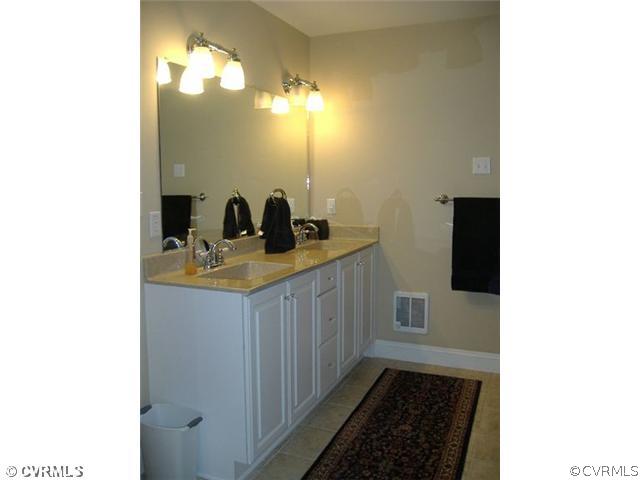 1752 Chinquapin Road Prospect, VA 23960 - Photo 8 of 16 a bathroom with a sink and a mirror