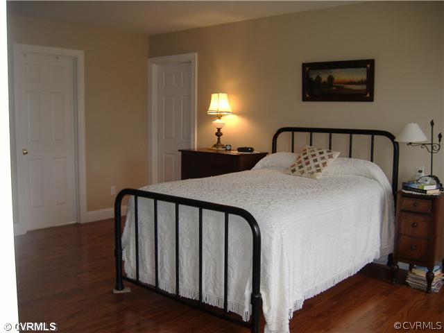 1752 Chinquapin Road Prospect, VA 23960 - Photo 9 of 16 a bedroom with a bed and a lamp