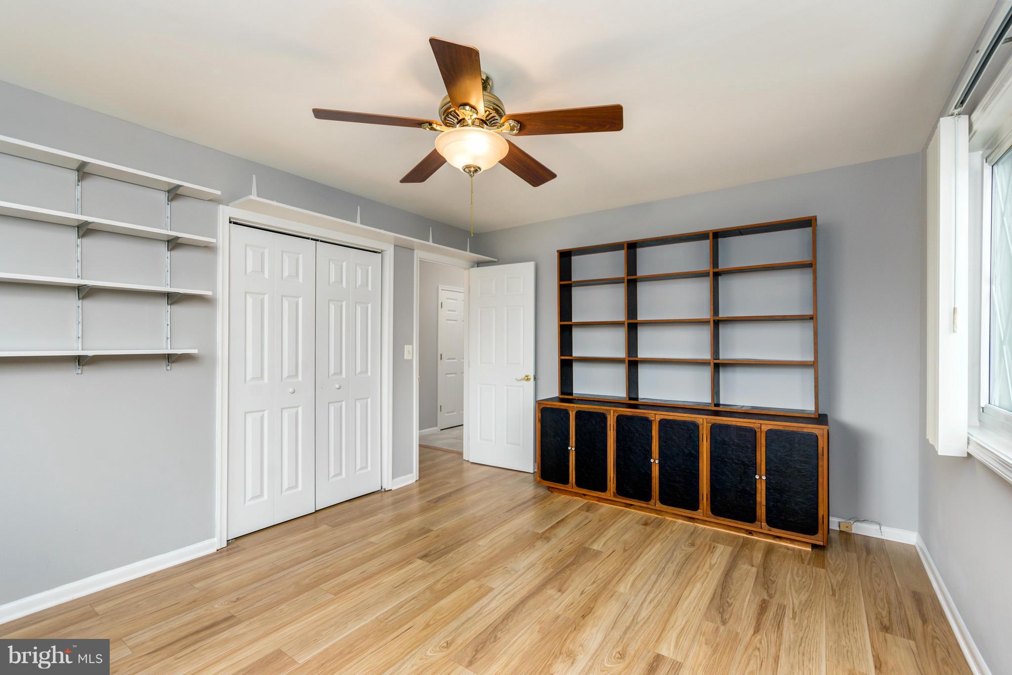 617 Barton Road Edgewater, MD 21037 - Photo 22 of 30 a view of an empty room with a window and wooden floor