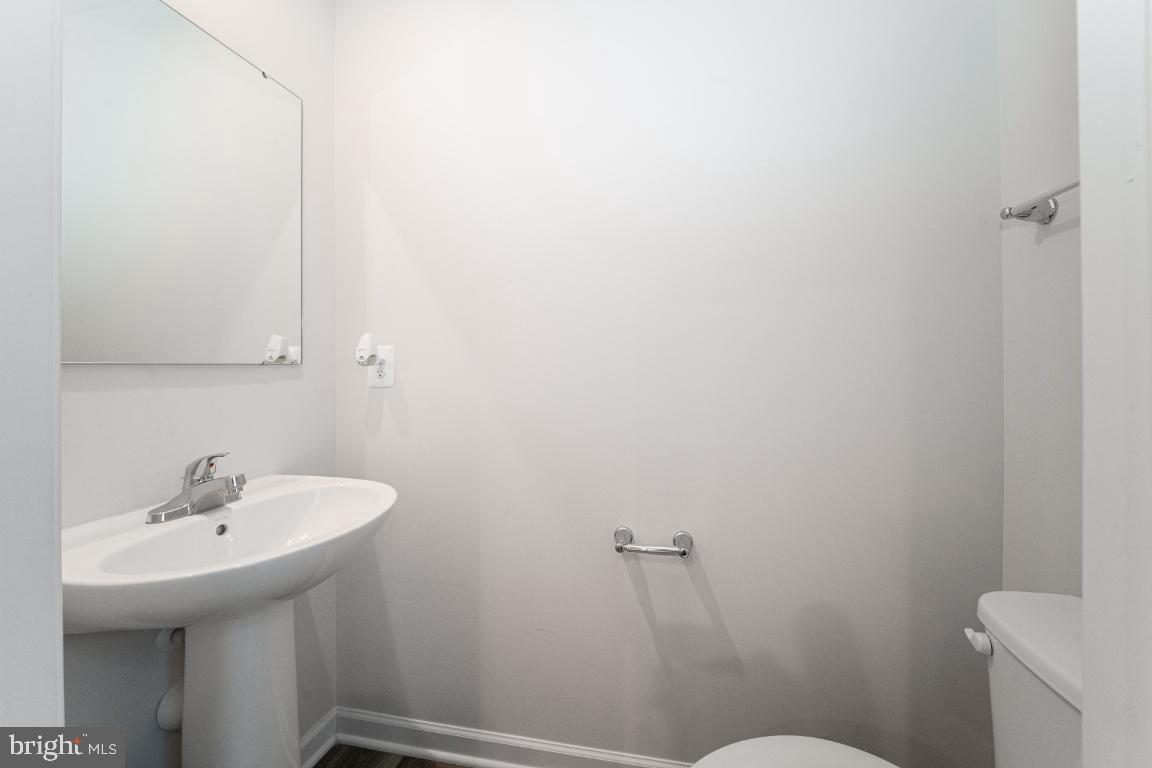 18256 Capital Court Ruther Glen, VA 22546 - Photo 15 of 26 a bathroom with a sink toilet and a mirror