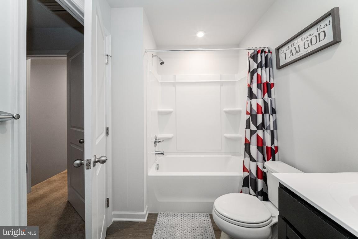 18256 Capital Court Ruther Glen, VA 22546 - Photo 21 of 26 a bathroom with a bathtub and a toilet