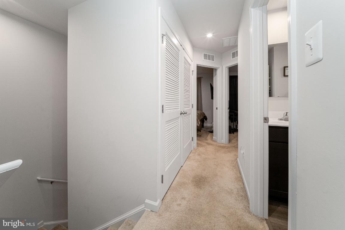 18256 Capital Court Ruther Glen, VA 22546 - Photo 23 of 26 a view of a hallway with white walls