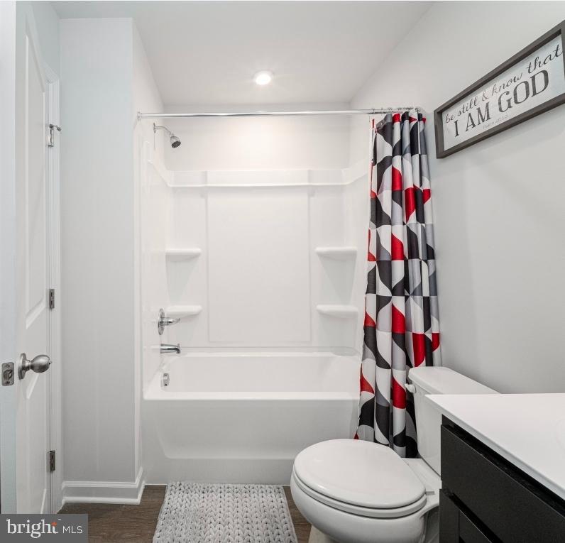 18256 Capital Court Ruther Glen, VA 22546 - Photo 7 of 26 a white toilet sitting next to a bath tub
