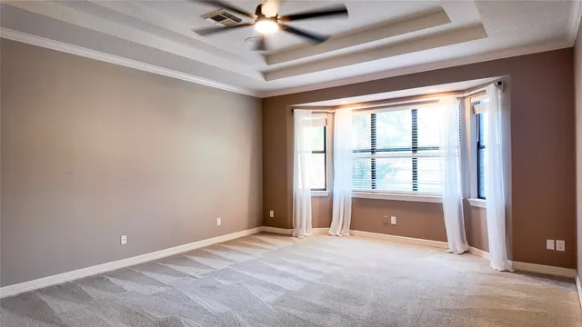 a front view of a house with outdoor seating