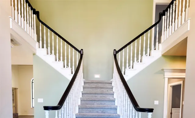 a kitchen with granite countertop a sink stainless steel appliances and cabinets