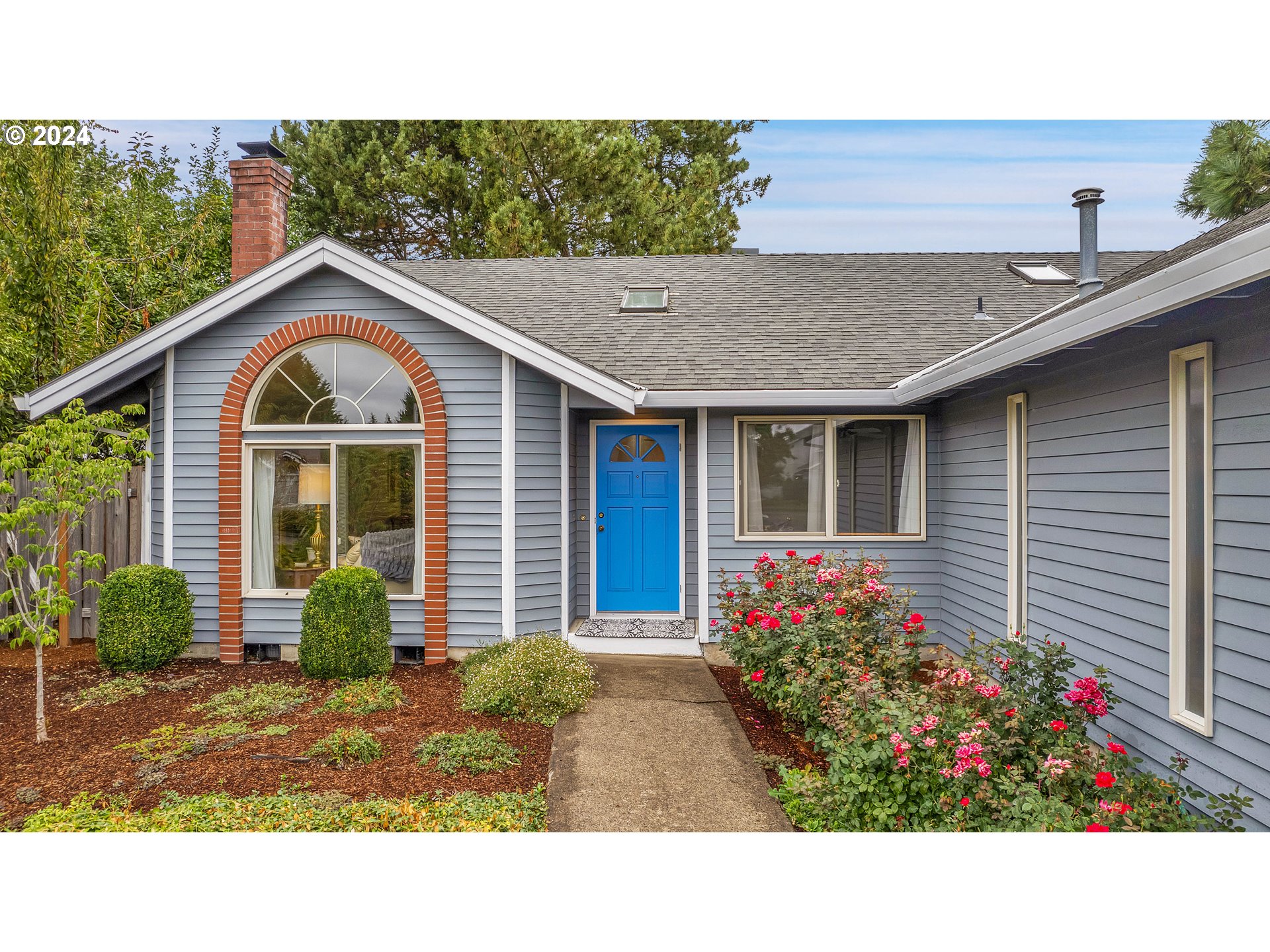 1580 Northwest 175th Place Beaverton, OR 97006 - Photo 1 of 28 a view of a house with a yard and plants