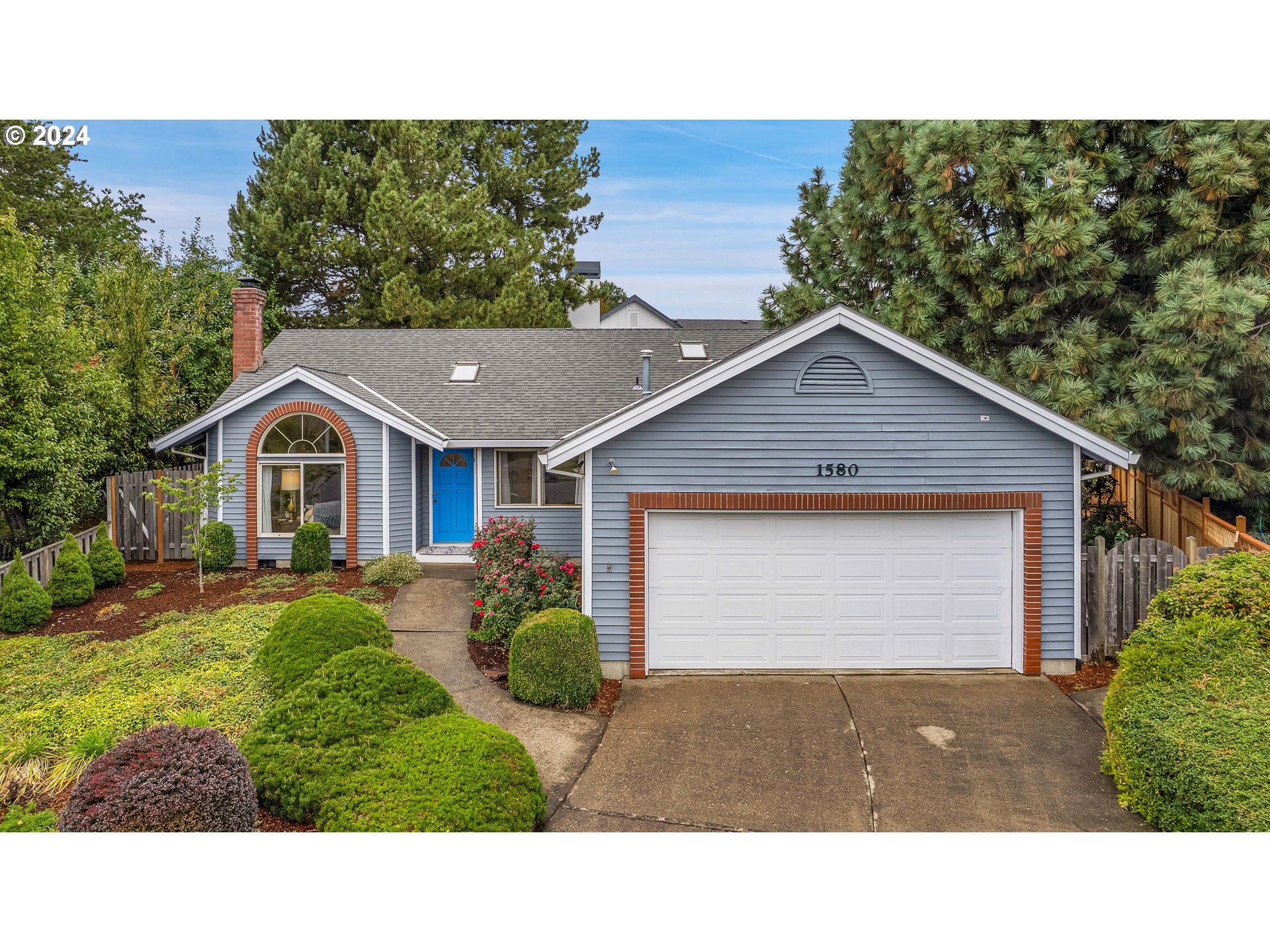 1580 Northwest 175th Place Beaverton, OR 97006 - Photo 2 of 28 a bathroom with a sink and a yard