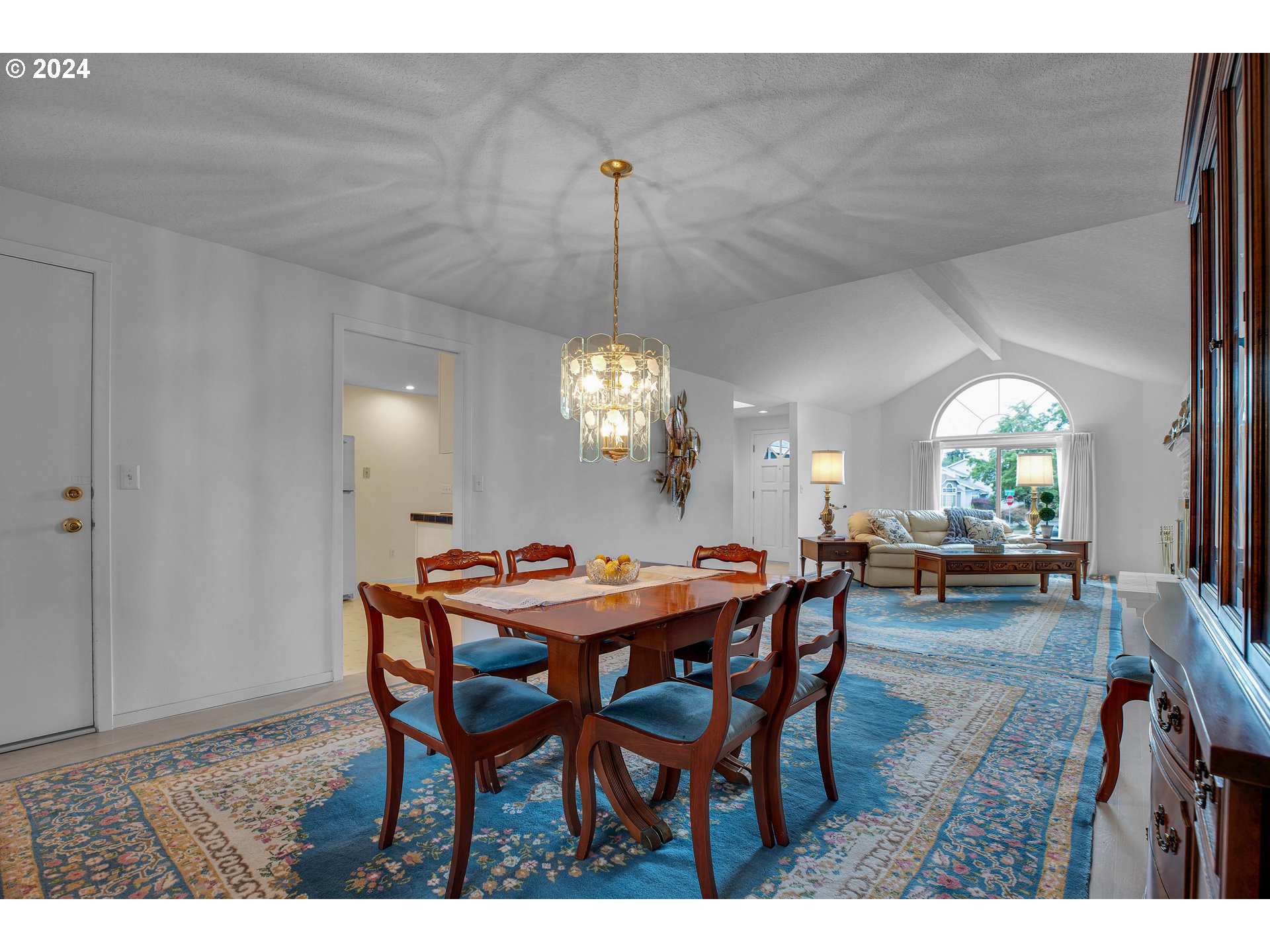 1580 Northwest 175th Place Beaverton, OR 97006 - Photo 9 of 28 a view of a dining room with furniture and chandelier