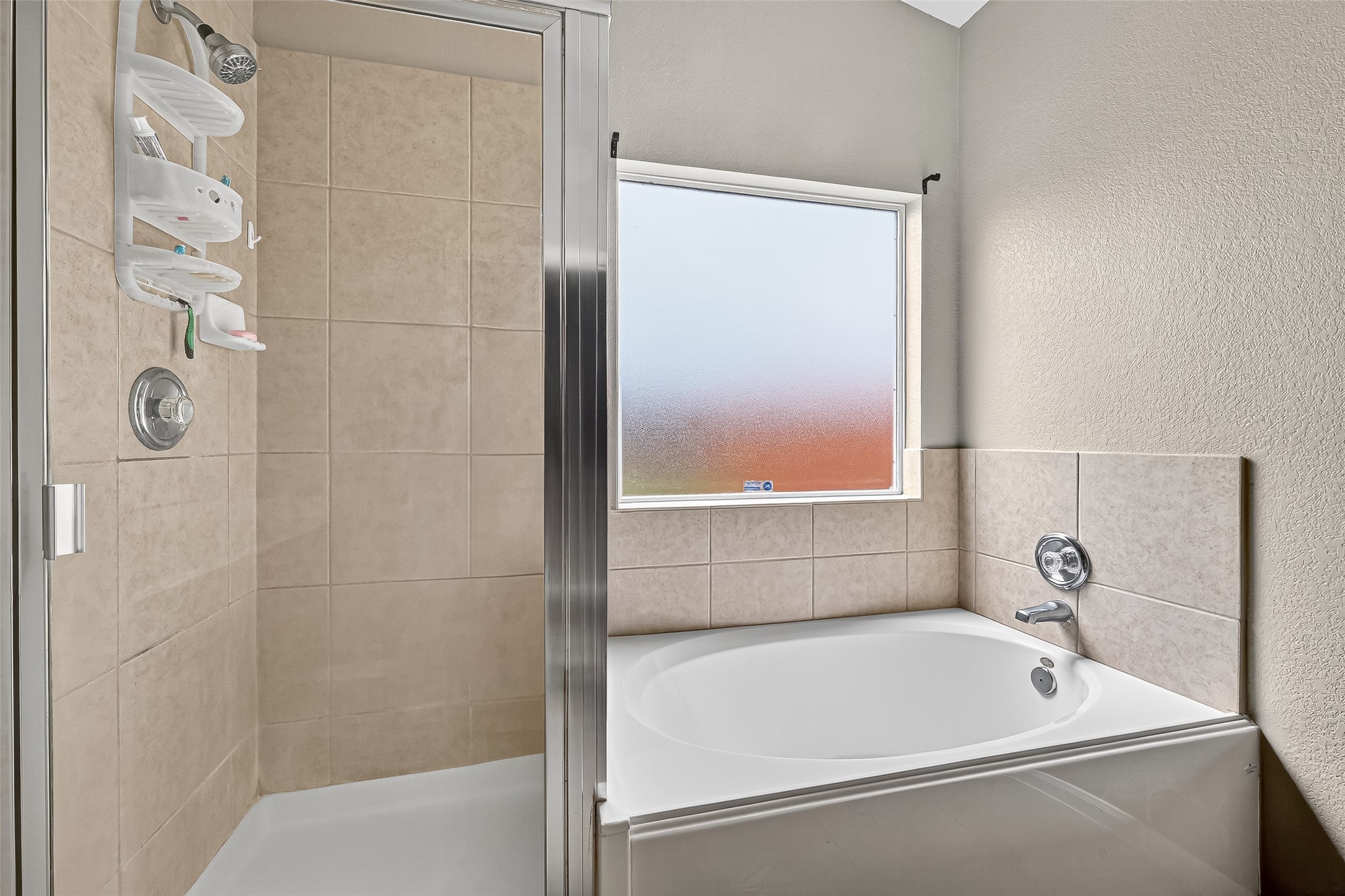 215 Little Summer Drive Rosenberg, TX 77469 - Photo 11 of 16 a bathroom with a tub and a shower