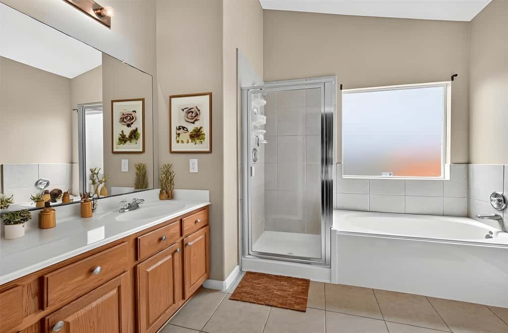 215 Little Summer Drive Rosenberg, TX 77469 - Photo 9 of 16 a spacious bathroom with a tub sink and mirror