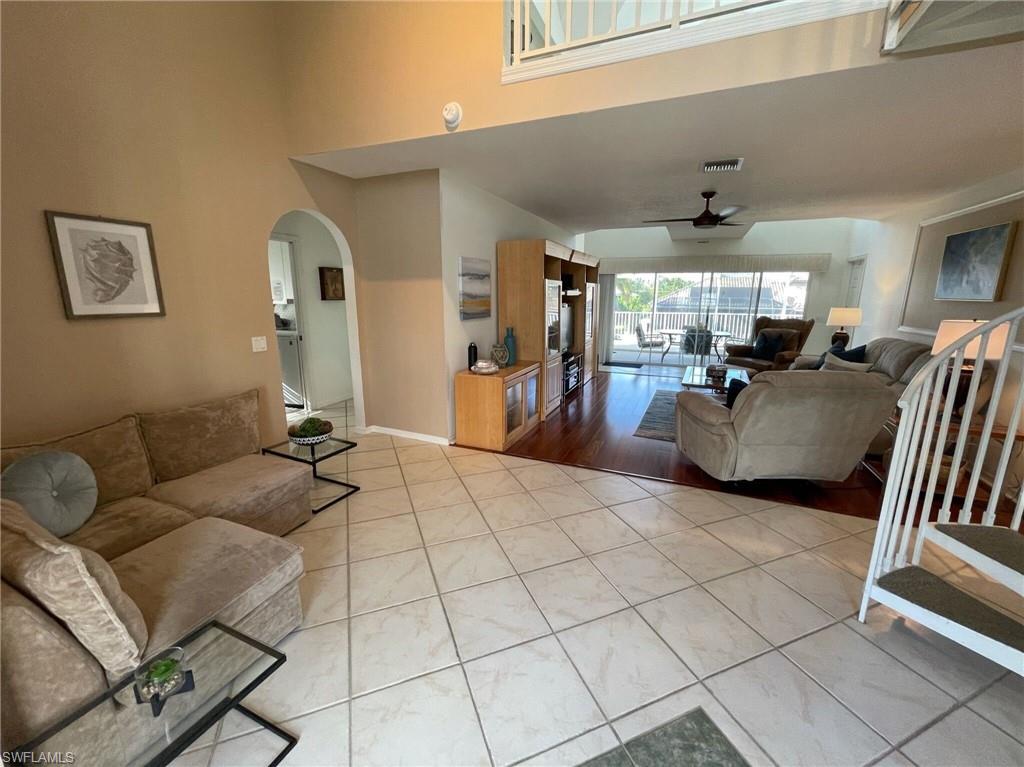 405 Cristobal Street Naples, FL 34113 - Photo 12 of 24 a living room with furniture and a flat screen tv