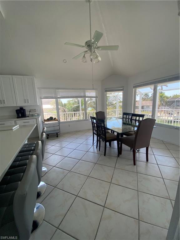 405 Cristobal Street Naples, FL 34113 - Photo 18 of 24 a view of a dining room with furniture and window