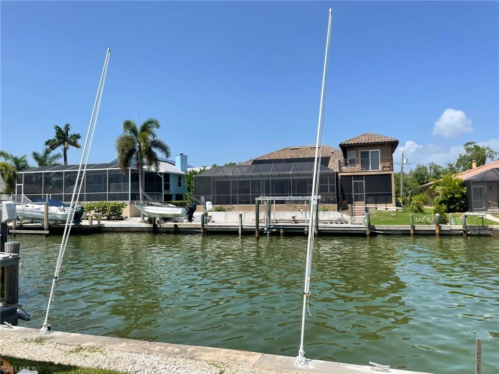 405 Cristobal Street Naples, FL 34113 - Photo 2 of 24 a view of swimming pool with chairs