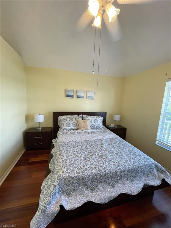 405 Cristobal Street Naples, FL 34113 - Photo 21 of 24 a bedroom with a bed and a chandelier