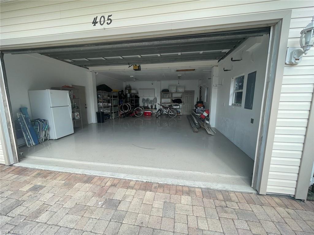 405 Cristobal Street Naples, FL 34113 - Photo 3 of 24 a view of garage with furniture