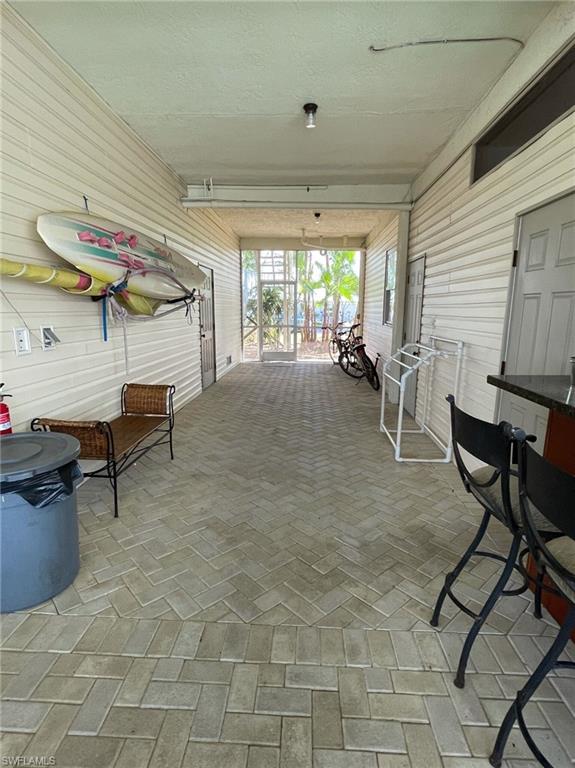 405 Cristobal Street Naples, FL 34113 - Photo 4 of 24 a room with furniture and a large window