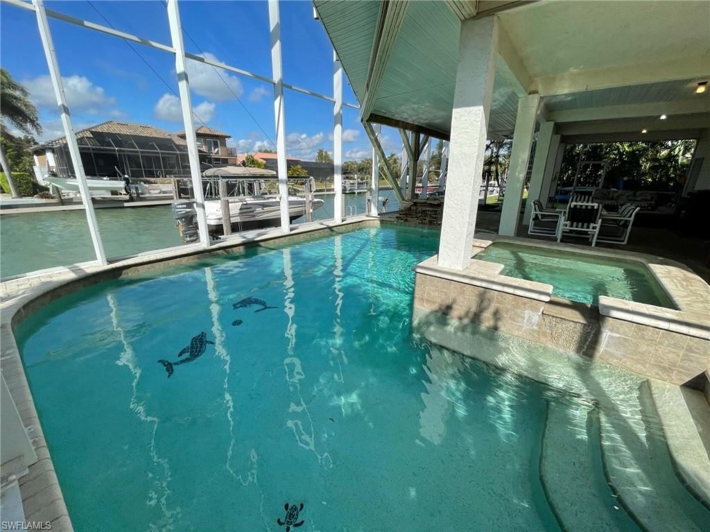 405 Cristobal Street Naples, FL 34113 - Photo 5 of 24 a view of a backyard with a fountain